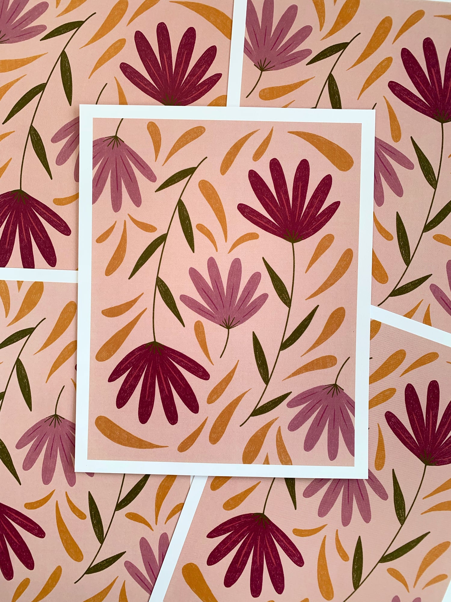 Spread of colorful flowers on pink background art prints